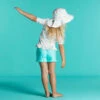 Chapeau Anti UV Bébé Réversible Rose Clair Et Imprimé Fleurs -Magasin De Matériel De Surf chapeau anti uv bebe reversible rose clair et imprime fleurs